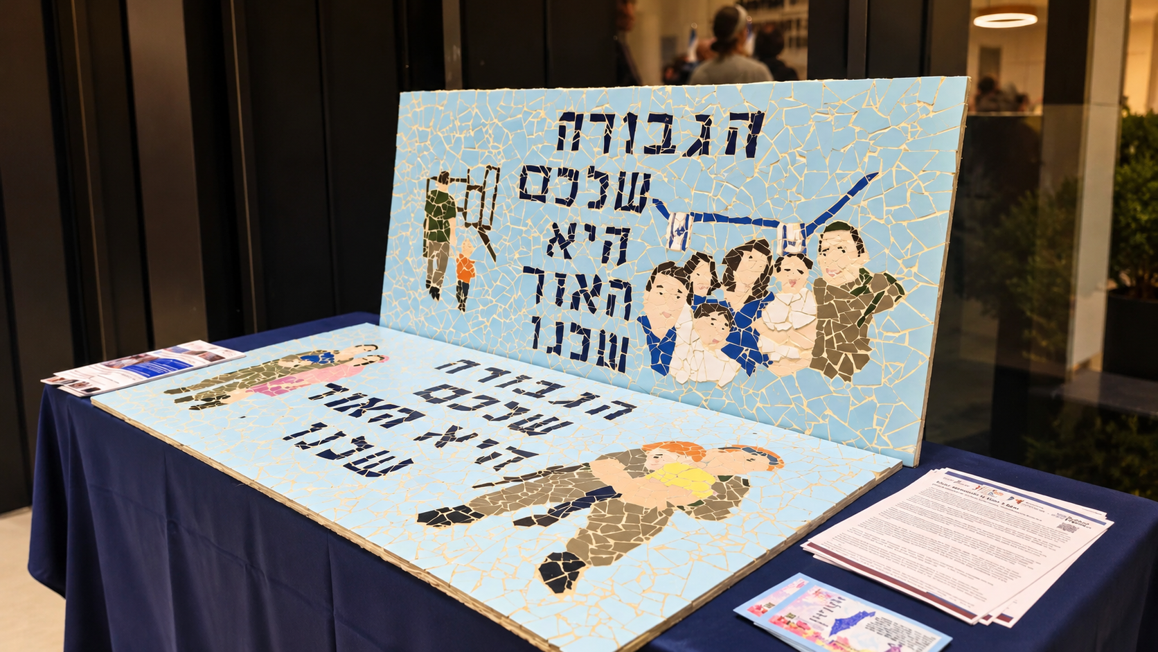 Two mosaic tribute murals on display at an event